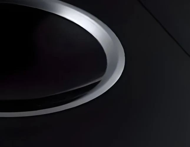 Edge finish detail on concave heat resistant glass-ceramic panel