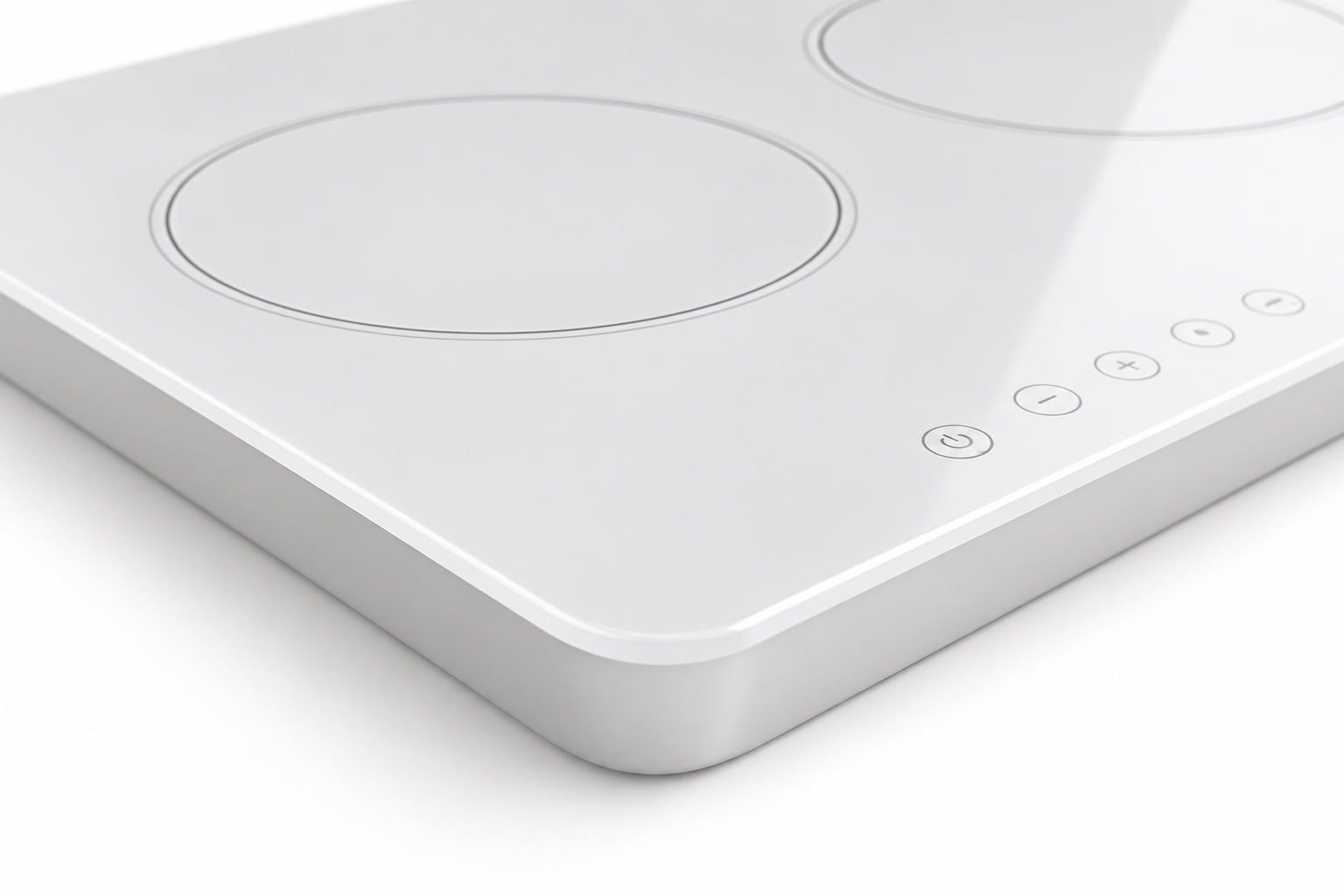 Close view of the rounded outside corner of a white ceramic glass cooktop panel