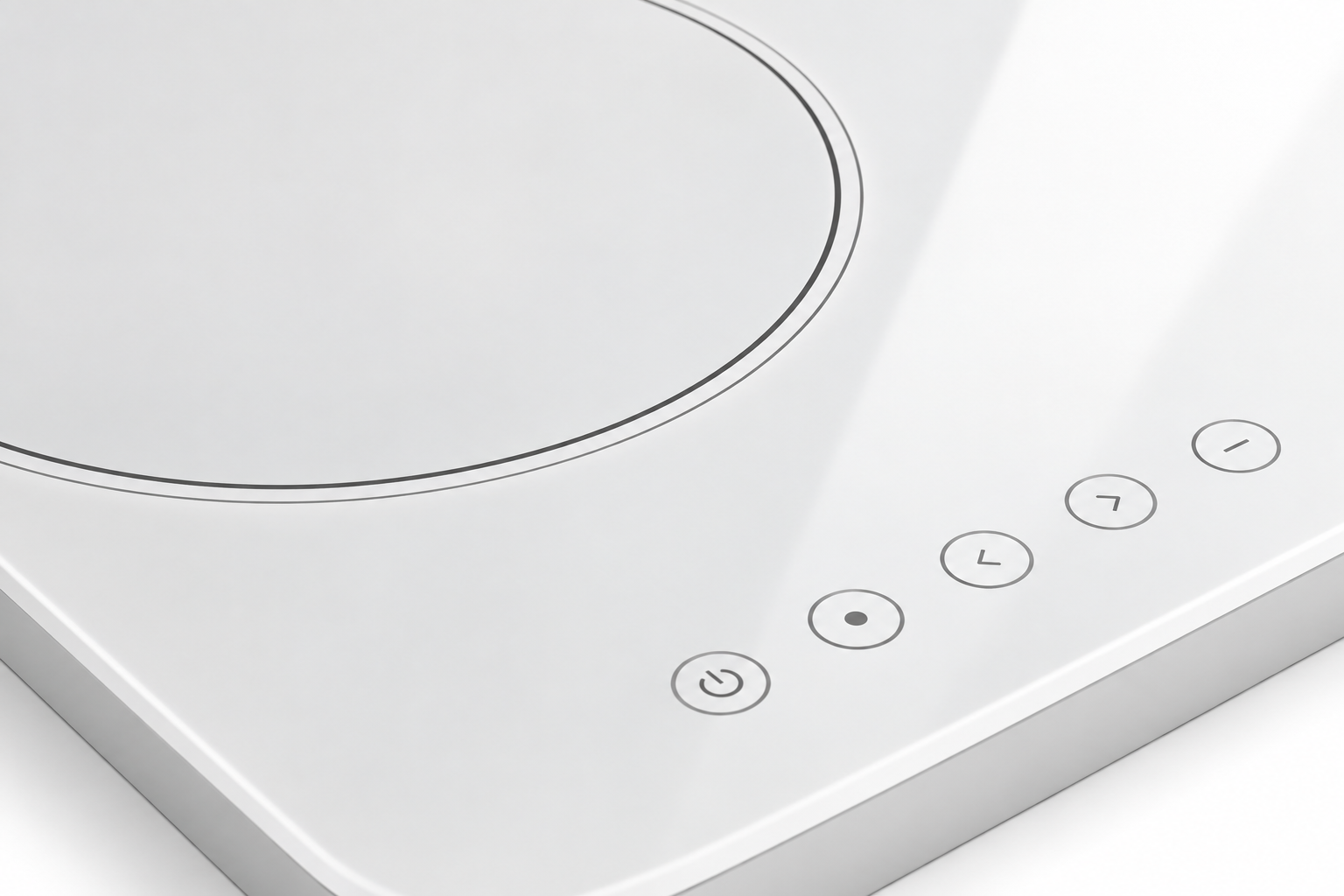 Close view of gray cooking-zone boundary and touch-control markings on a white glass-ceramic panel