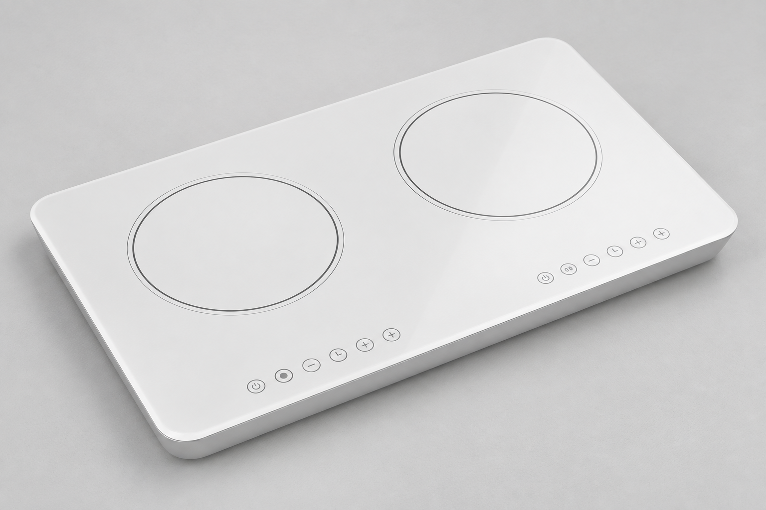 Oblique view of a white two-zone glass-ceramic panel showing the printed rings and front control symbols