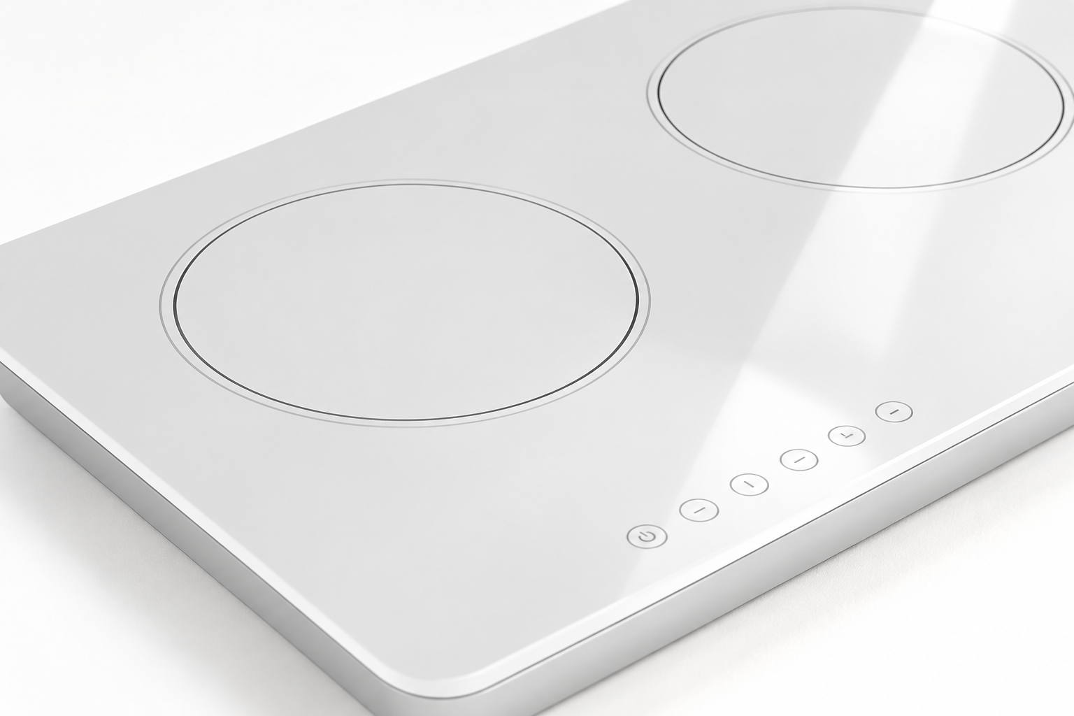 Close oblique view of glossy white glass-ceramic surface and gray cooking-zone graphics under angled light