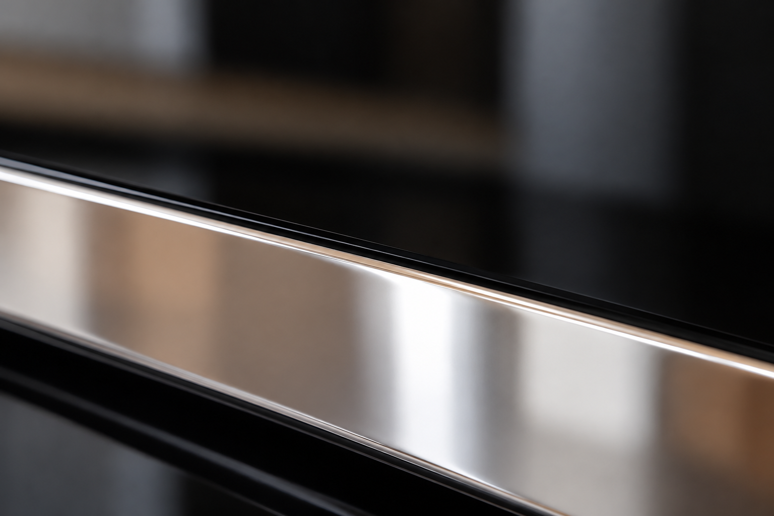 Close view of black appliance-control glass beside its silver external trim